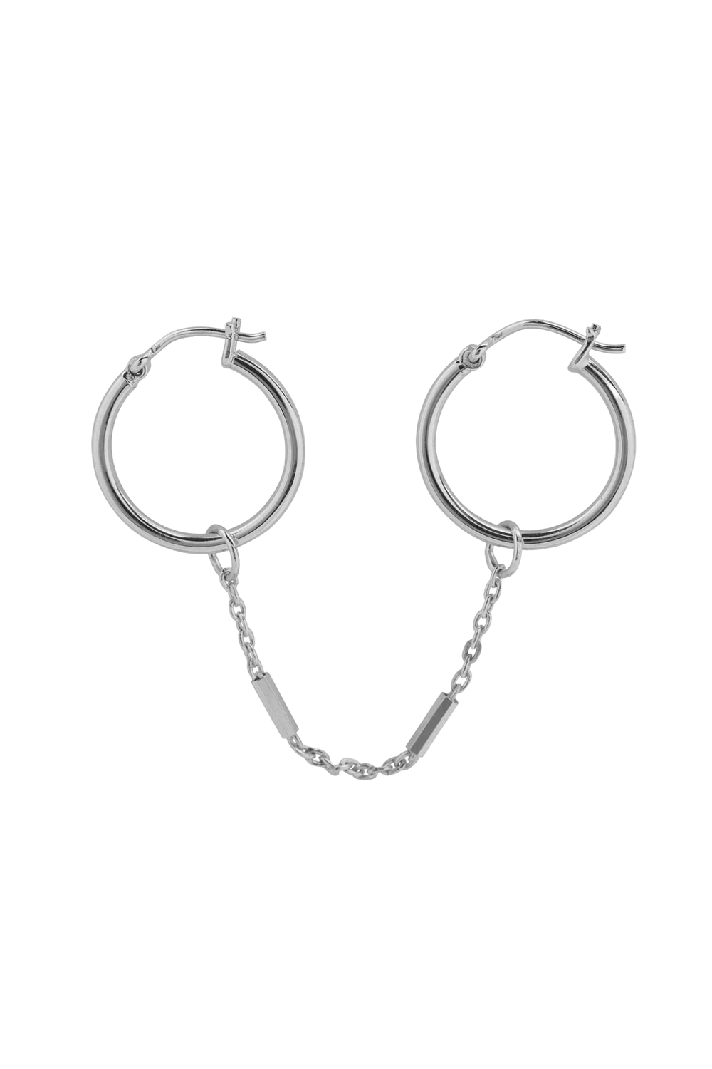 Handmade 925 sterling silver earring by Xzota, with a chain connecting two small hoops. Available at Maison Maeva.