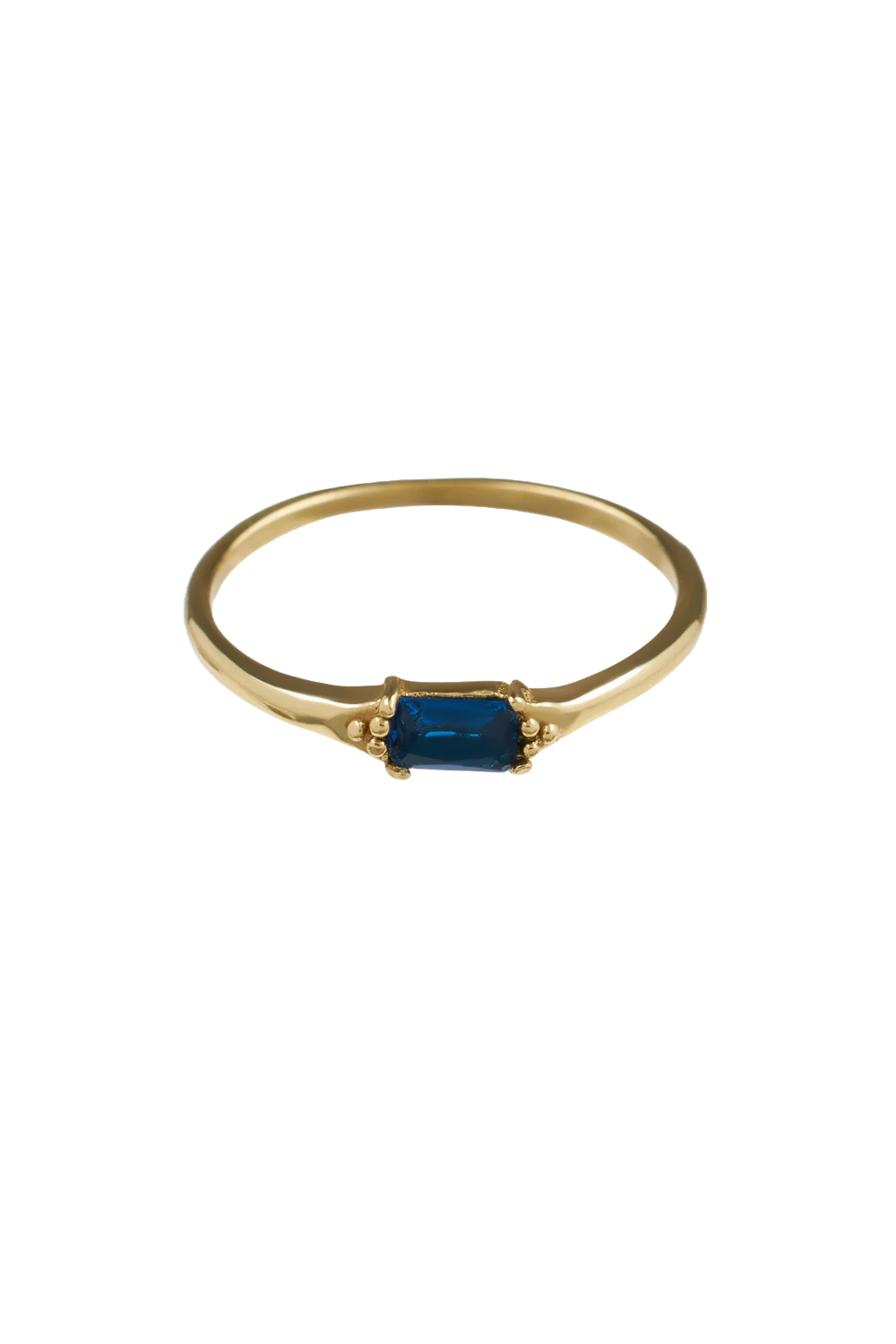 Close-up of the Brass Blue Baguette Ring with a rectangular blue stone, handmade in Bali, offered by Maison Maeva.

