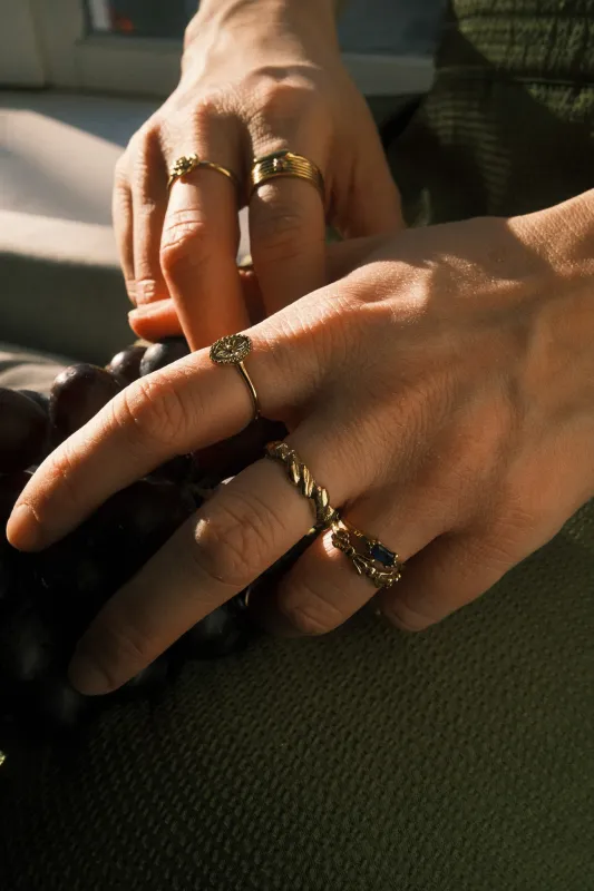 Brass Blue Baguette Ring worn on hand, showing its timeless design and deep blue stone.