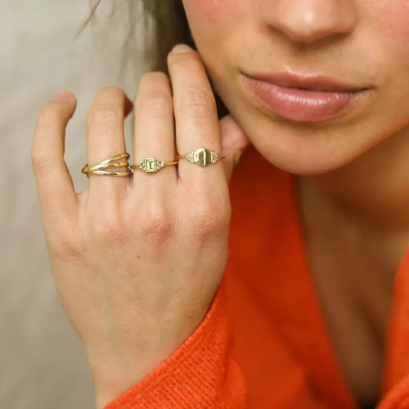 Vintage Peridot Flower Ring worn on the hand, showcasing the elegant flower shape and gold-plated band.