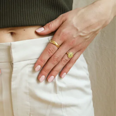 Kae Peridot Flower Ring by Josephina styled with other stacking rings