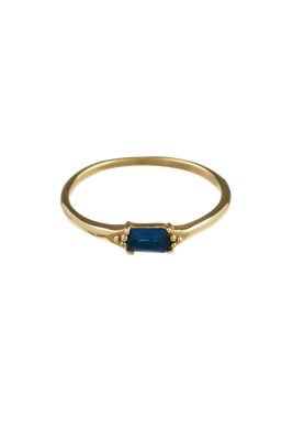 Close-up of the Brass Blue Baguette Ring with a rectangular blue stone, handmade in Bali, offered by Maison Maeva.


