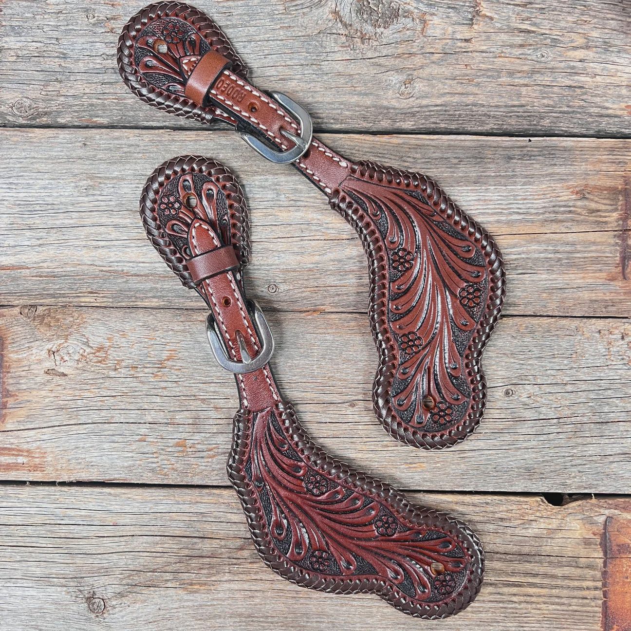 Dark oil braided spur straps