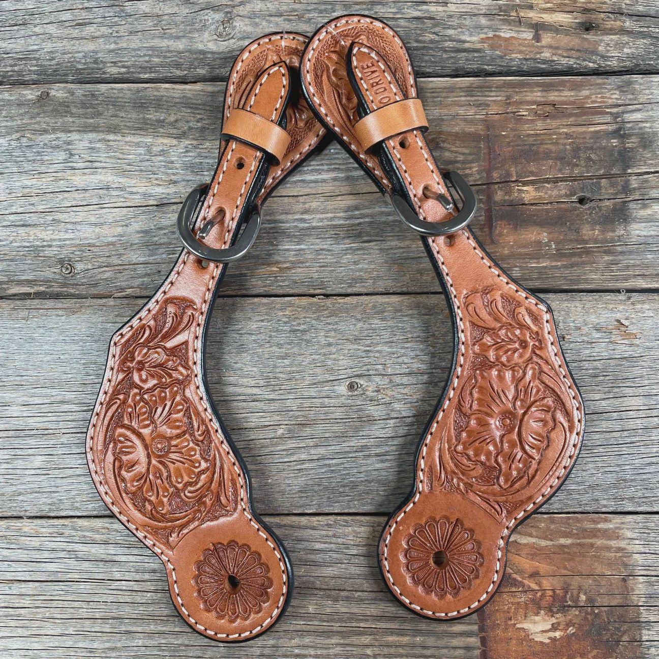 Light oil floral tooled spur straps