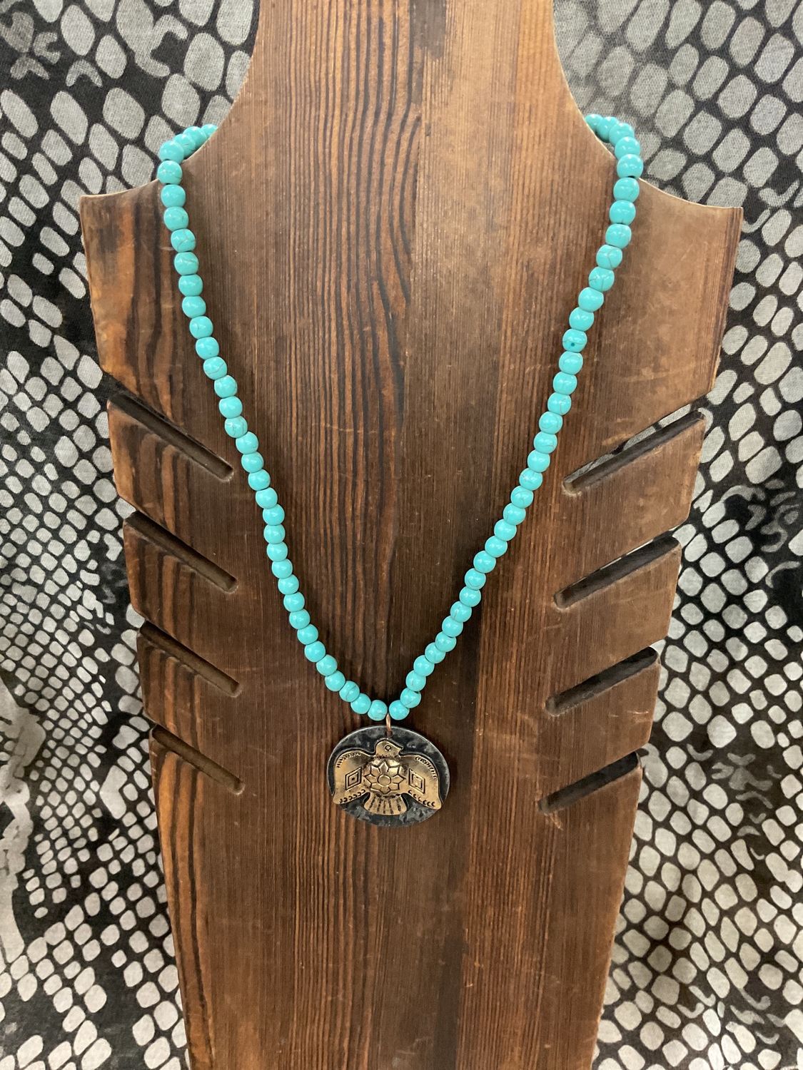 Burnished copper eagle charm