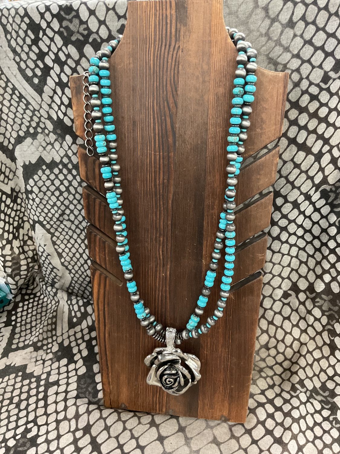 Silver and turquoise beads with flower pendant