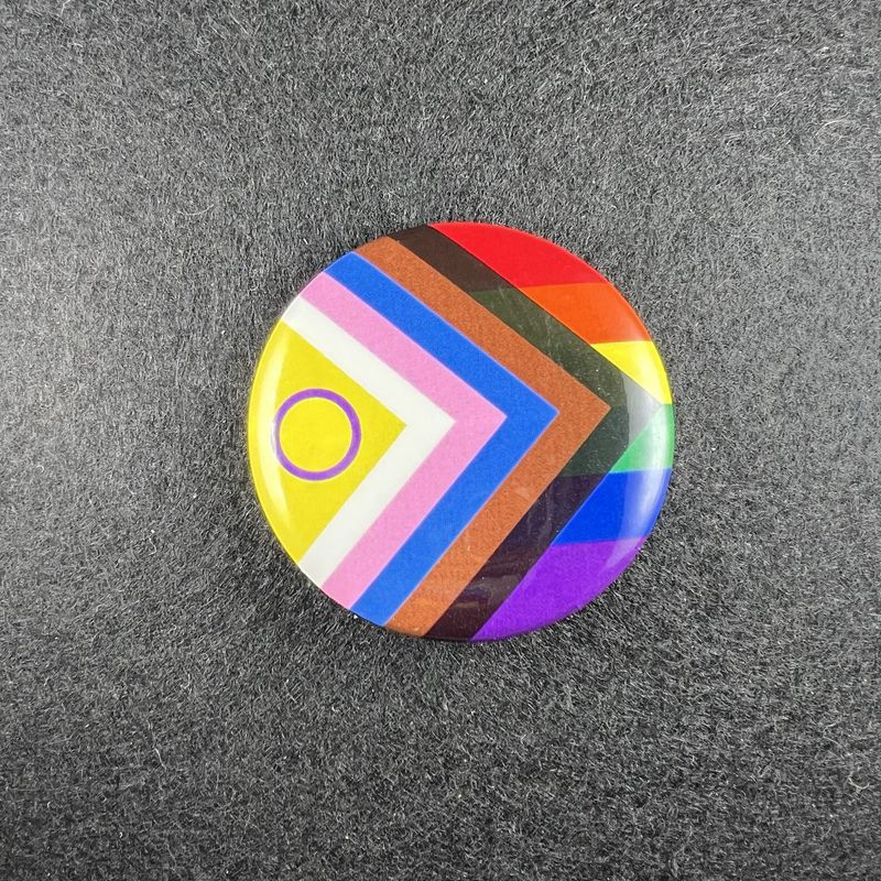 Inclusive Pride button with round intersex symbol