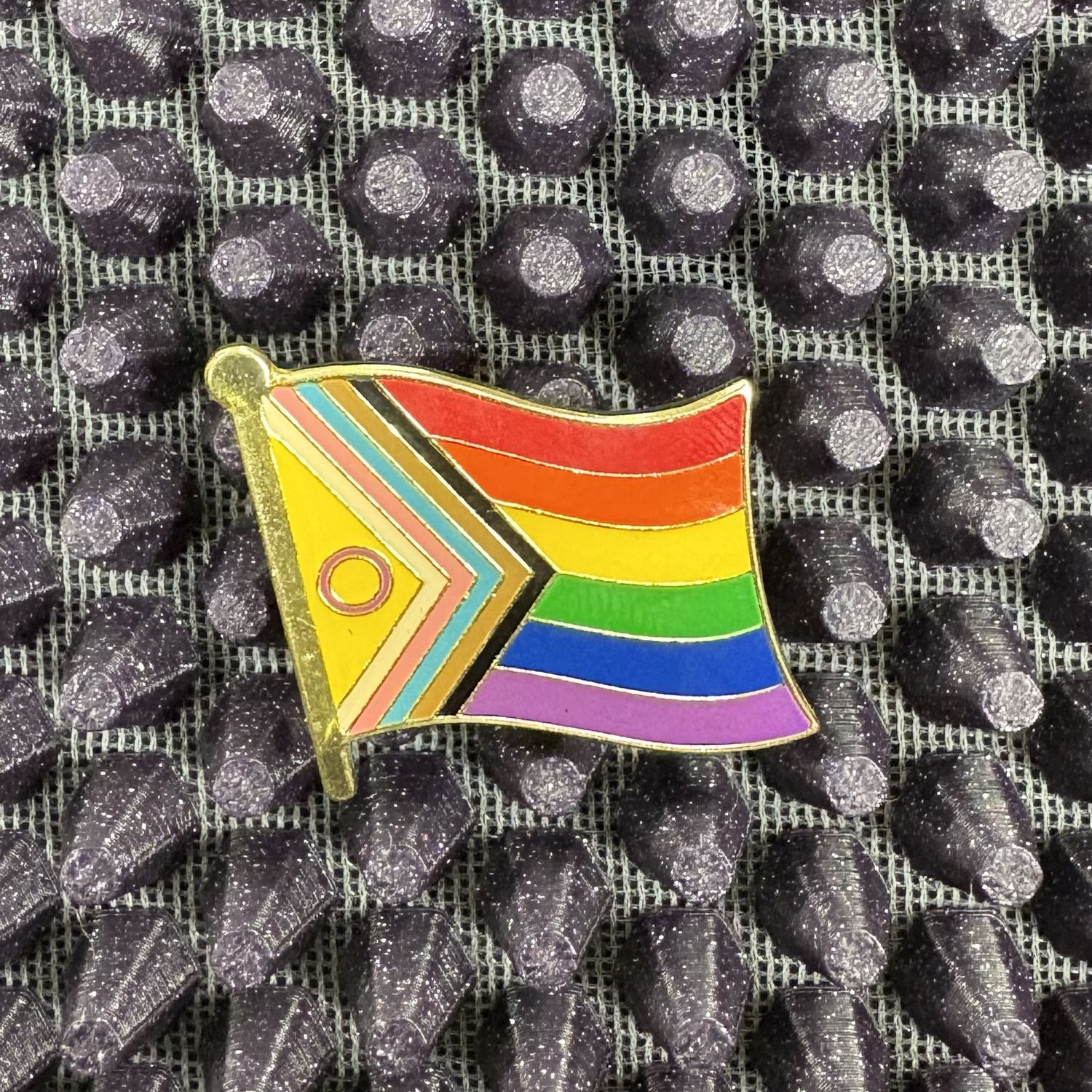 Progress flag pin