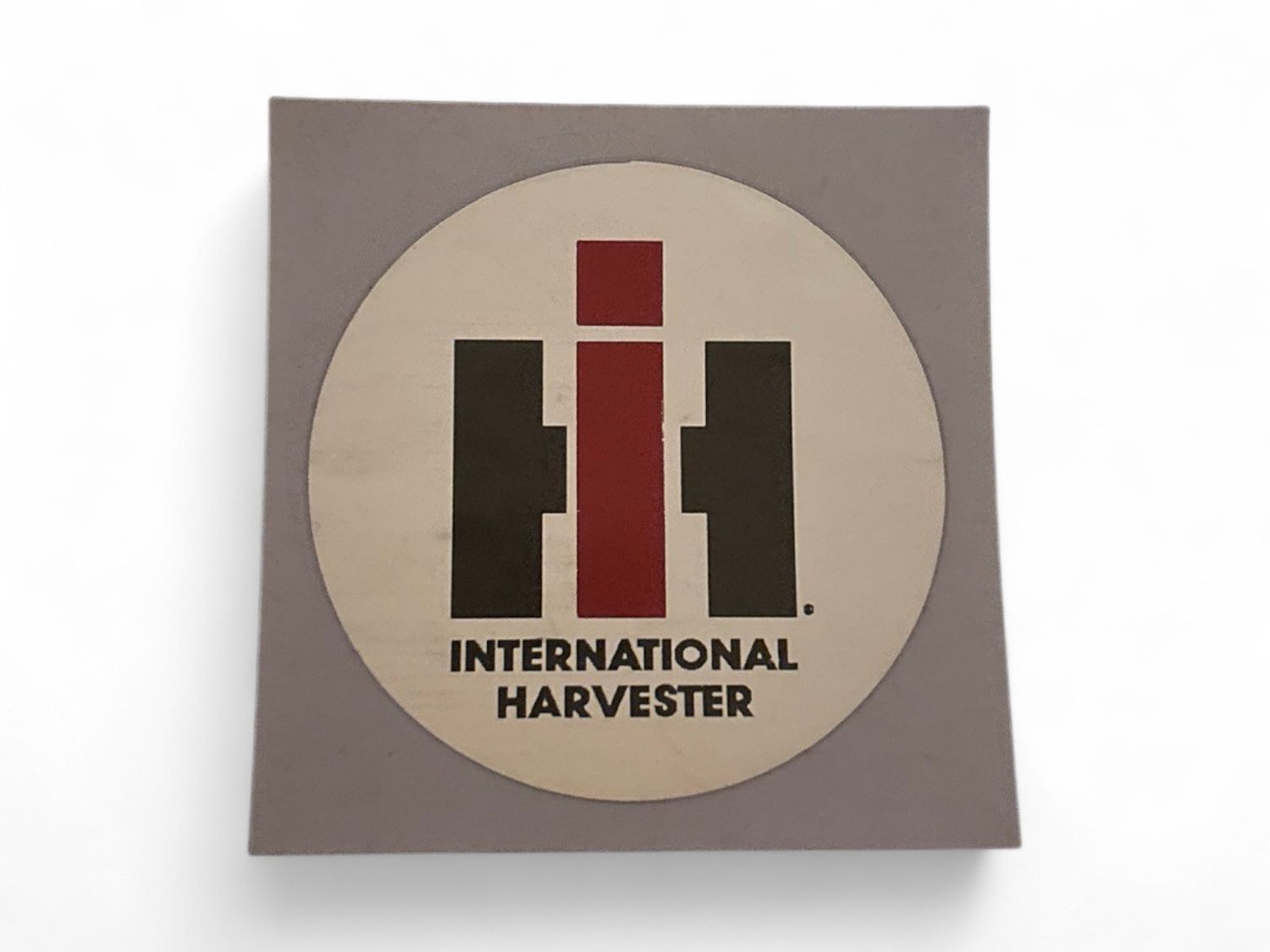 IH with Silver Round Background 2 inch