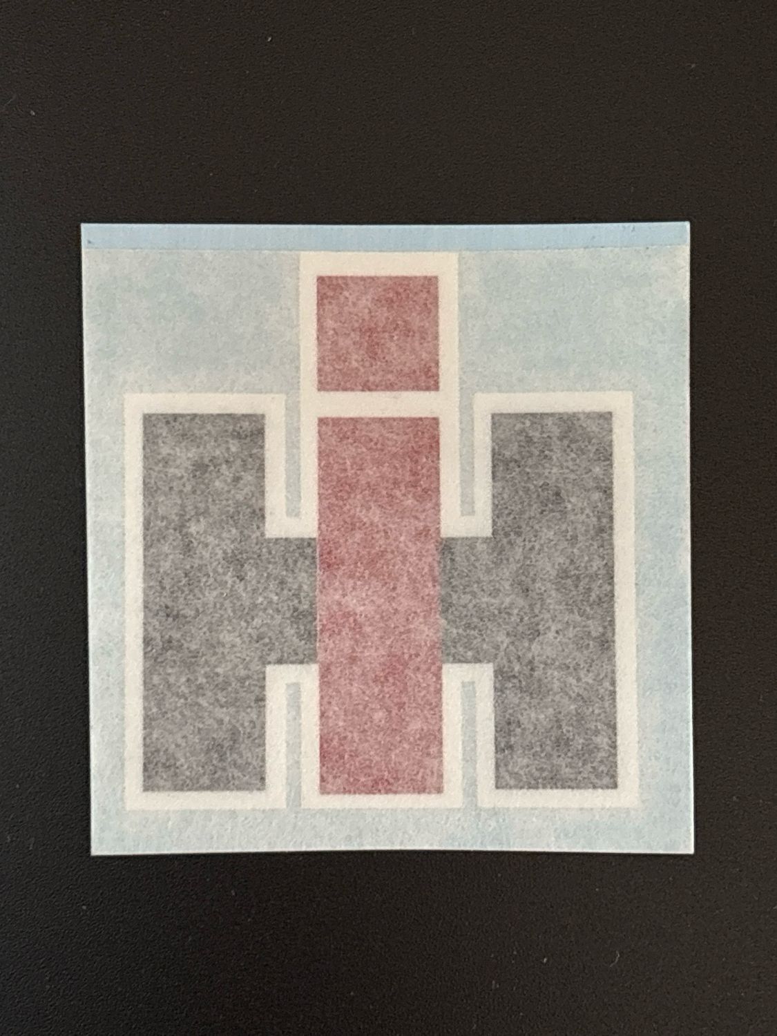 IH Logo with White Outline 2 1/8" X 2 1/4" tall