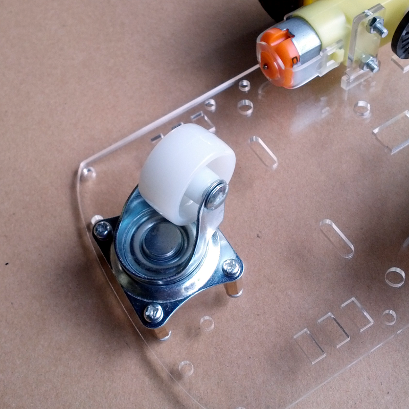 The caster wheel on the front mounted with standoffs and screws (included)
