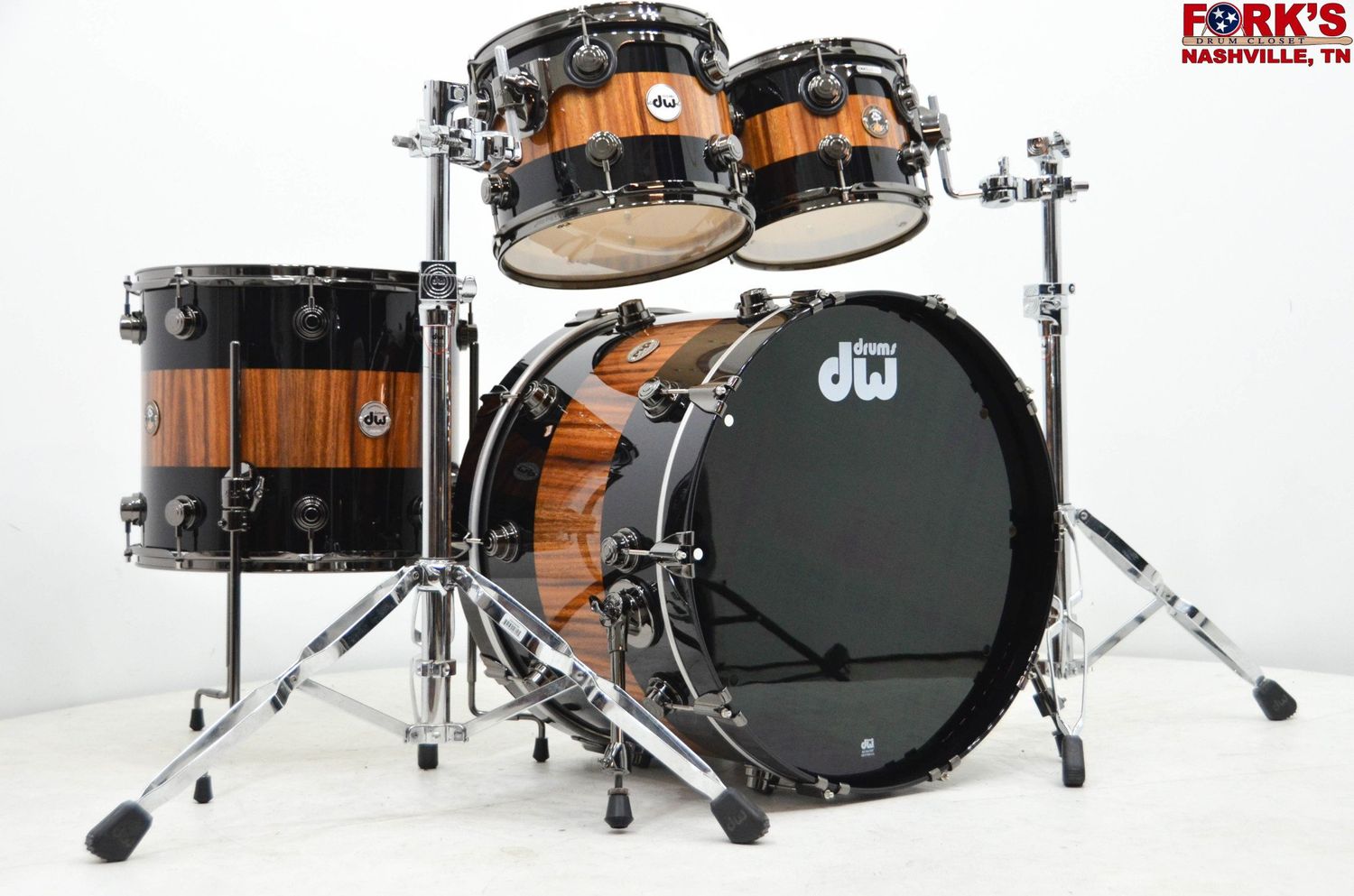 Pre-Owned DW Collector&#39;s Exotic 4pc Drum Kit - &quot;Rally Stripe over Monkey Pod&quot; w/ Black Nickel Hardware