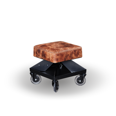 High-quality shop chair by Fast Freddy Equipment, featuring genuine black leather, a sturdy square base, and smooth-rolling caster wheels