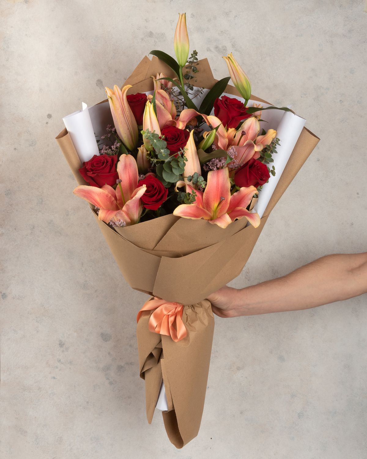 Floral arrangement with lilies and roses for any occasion