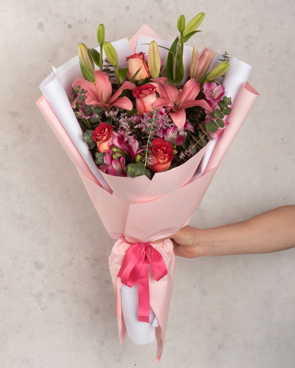Bouquet of lilies, roses and alstroemerias in pastel colors
