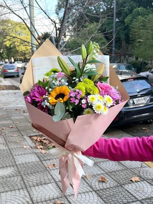 Rosé bouquet of seasonal mixed flowers in soft pink, white and yellow