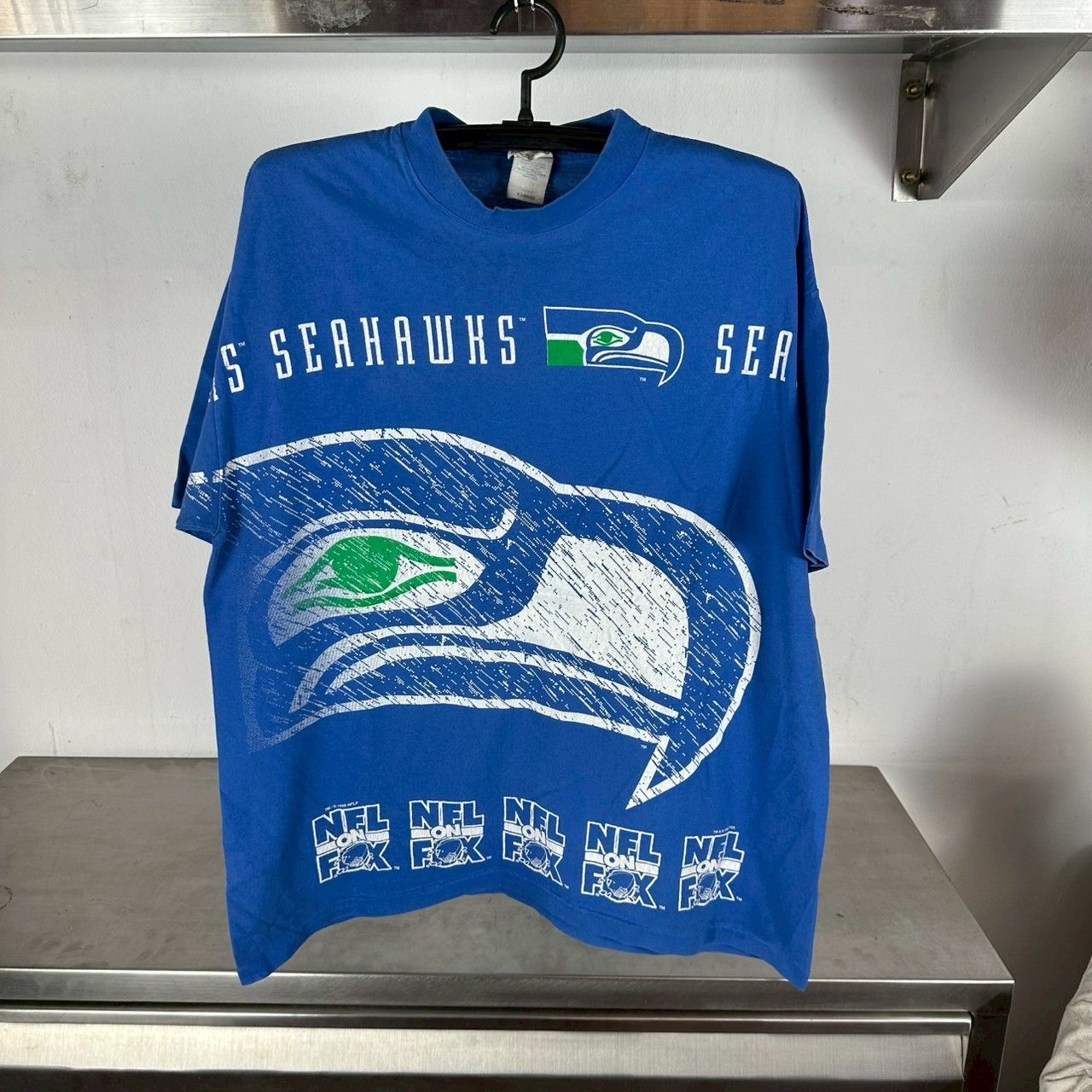 ​Vintage 90s Seattle Seahawks NFL On Fox AOP T-shirt