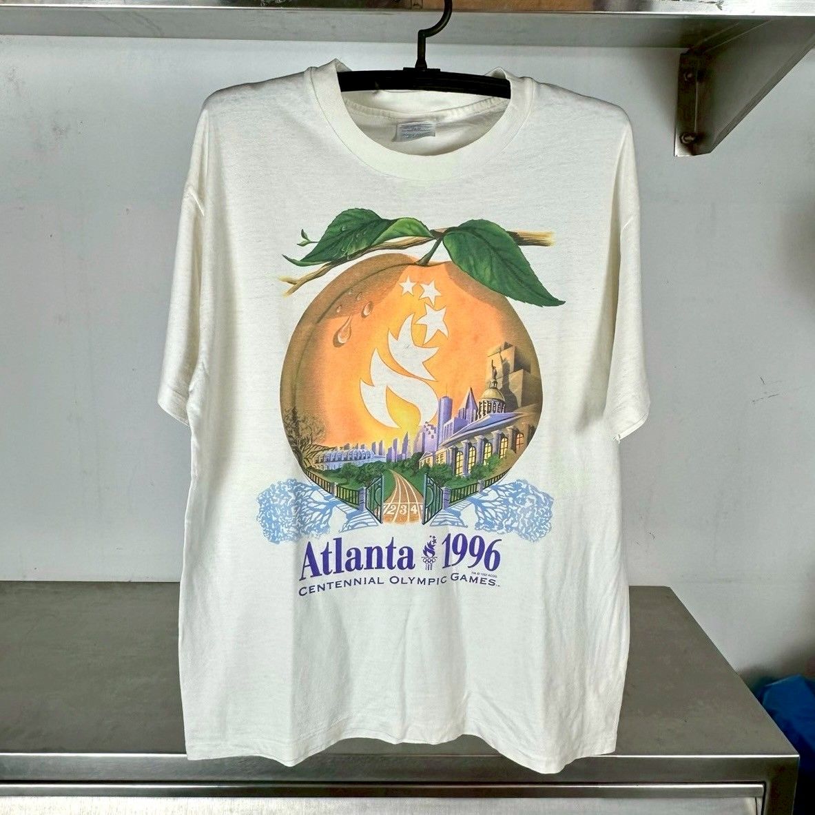 ​Vintage 1996 Atlanta Olympic Games Peach Artwork T-shirt
