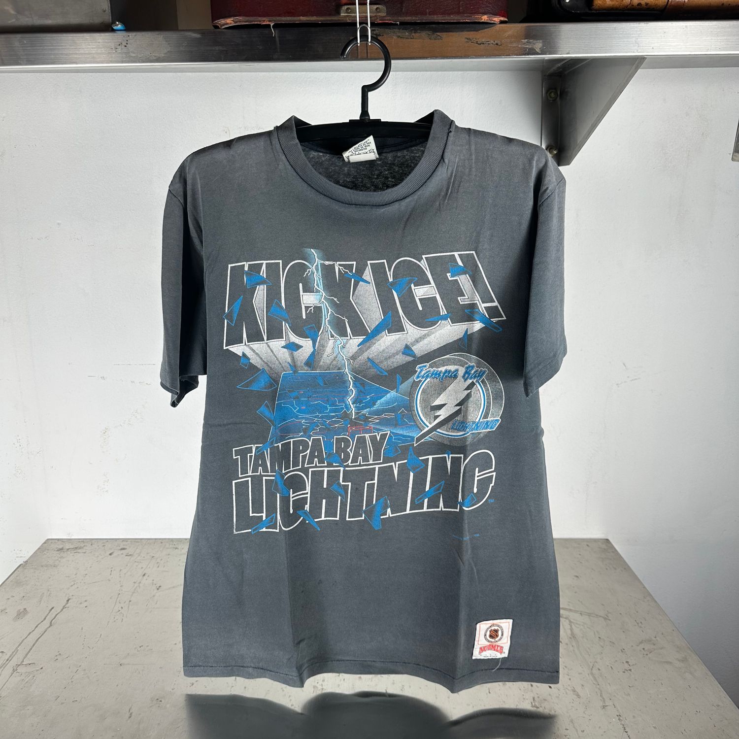​​Vintage 90s Tampa Bay Lightning Kick Ice! NHL Nutmeg Graphic T-shirt