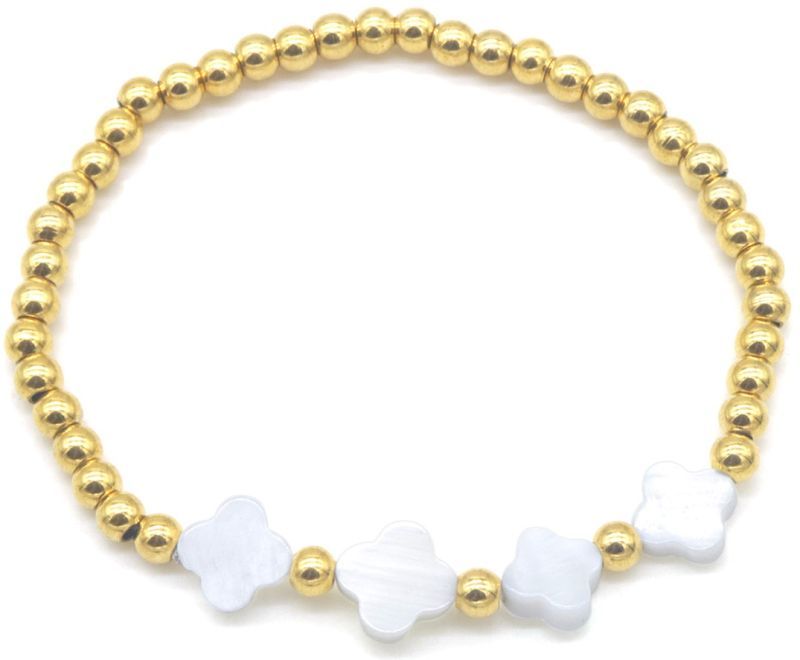 goud bolletjes armband met klavertjes