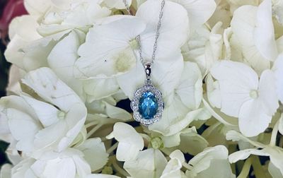 14KW 1.6g .90ctw Blue Topaz &amp; Diamond Halo Pendant 18&quot;