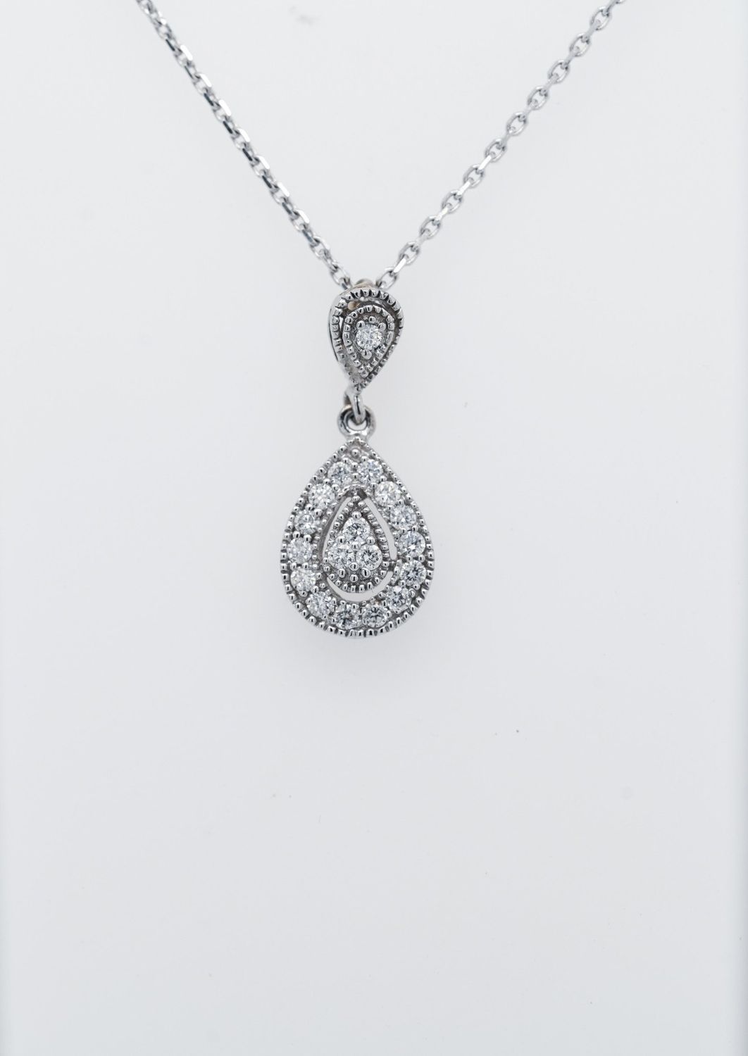 AEB-14KW 2.65g .22ctw Diamond Pear Shape Halo Pendant 18&quot;