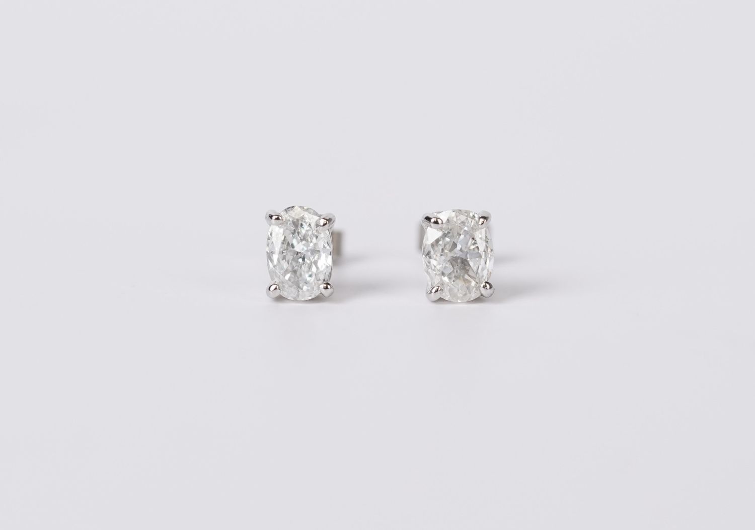 VVDT-14KW 1.08ctw H-I/SI2 Oval Diamond Solitaire Earrings