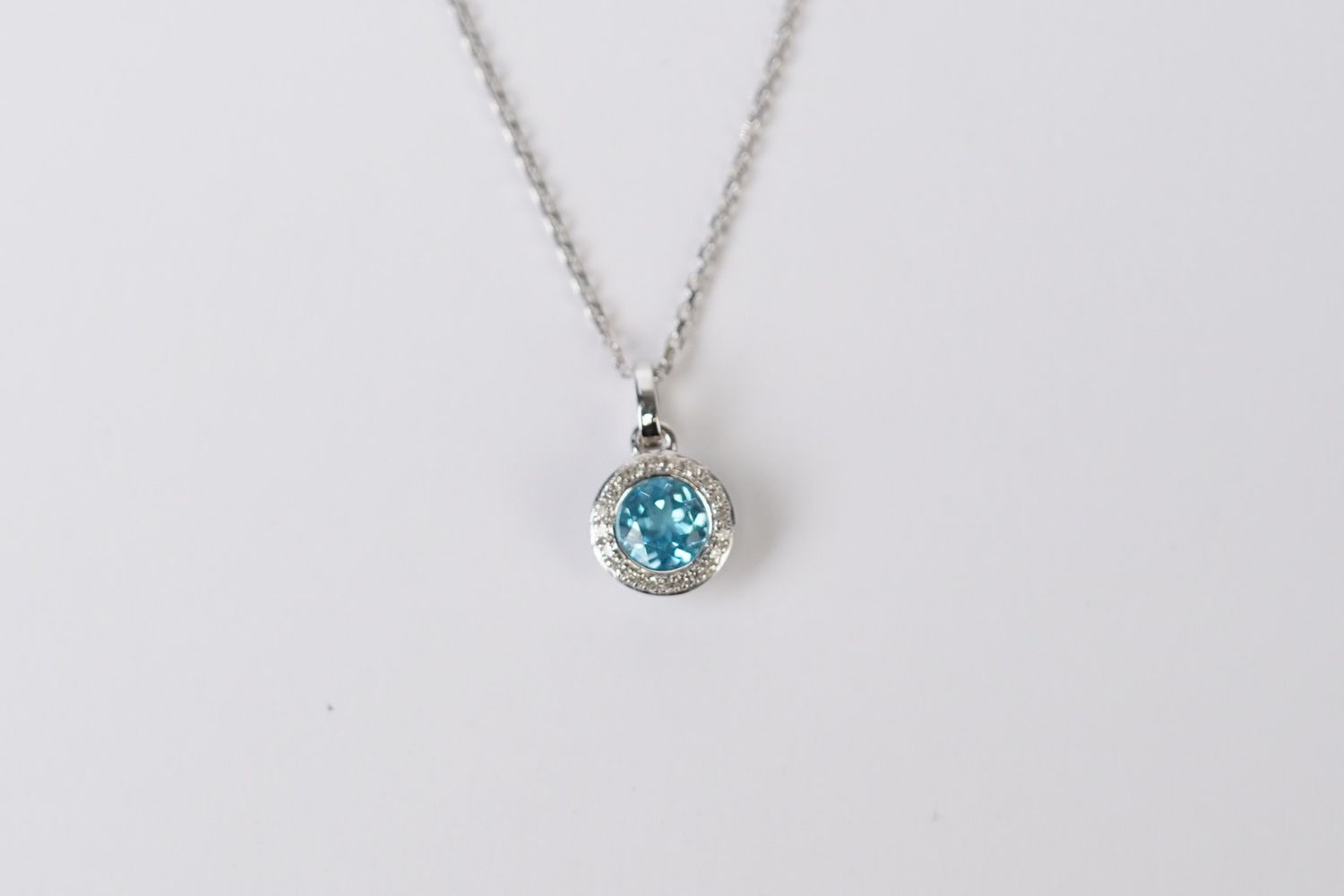ATT-14KW 2.43g 1.00ctw (.90ctr) Blue Topaz &amp; Diamond Halo Pendant 18&quot;