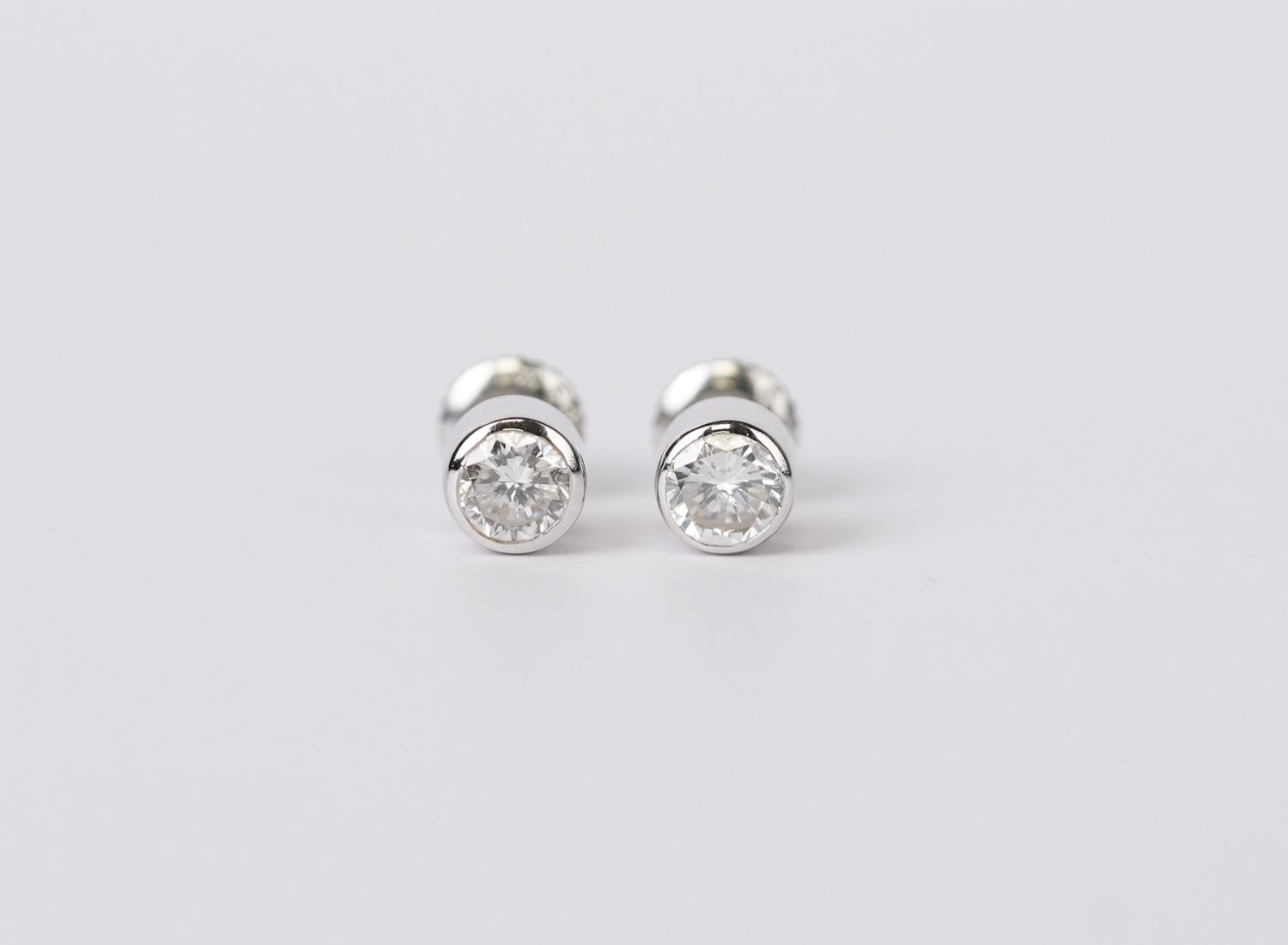 DTT- 14KW 1.38g .70ctw Round Diamond Bezel Stud Earrings