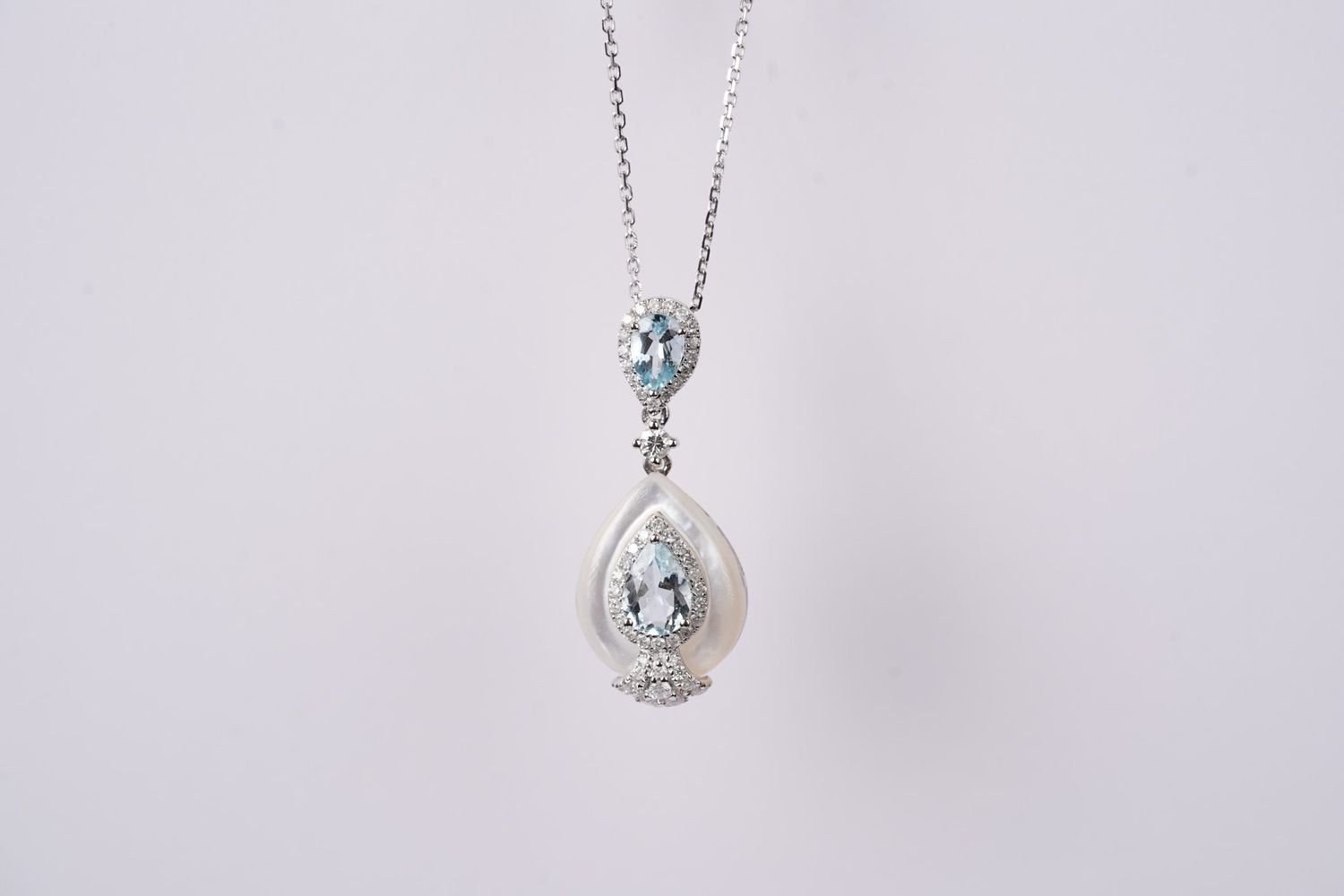 RTIX-14KW 2.13g .44ctw Diamond .92ctw Aquamarine/MOP Pendant 16-18&quot;