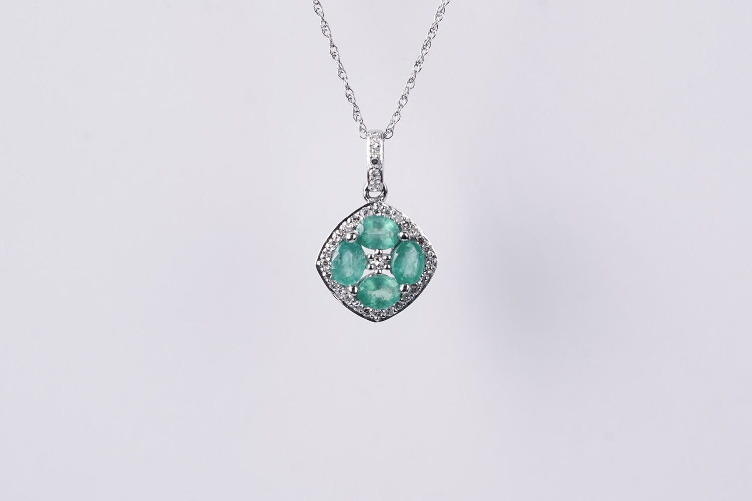 ATE-14KW 1.8g .64ctw Emerald &amp; Diamond Halo Pendant 18&quot;