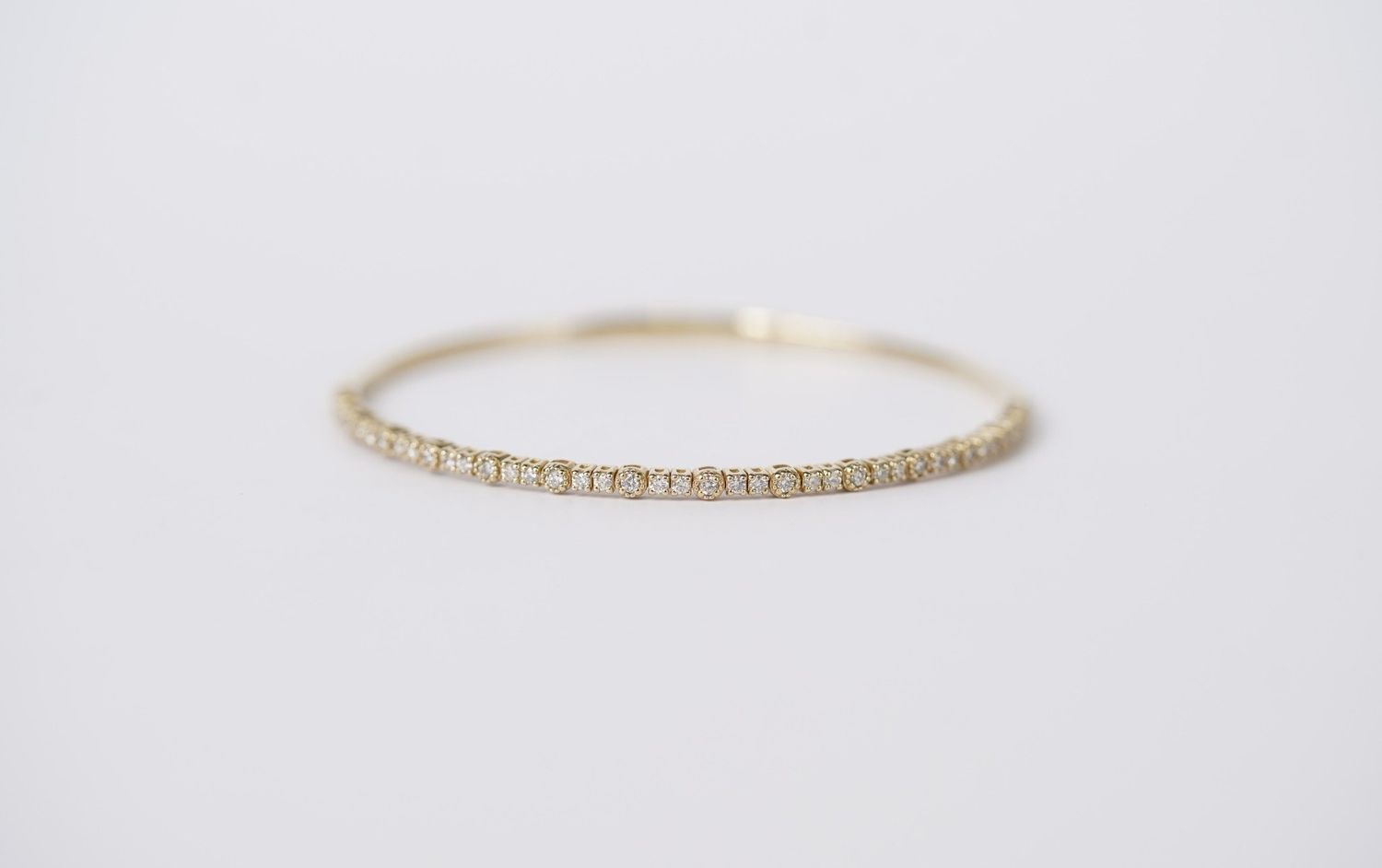 BLL- 14KY 7.8g .64ctw Diamond Flex Bangle