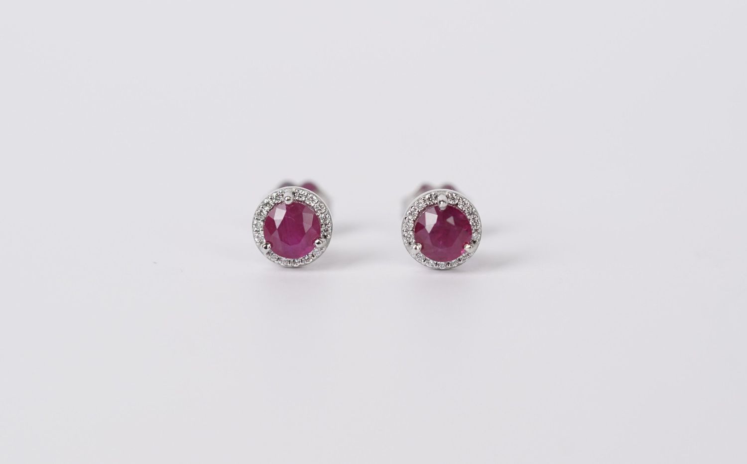 IAT- 14KW 1.57g .20ctw Diamond 1.25ctw Ruby Halo Stud Earrings