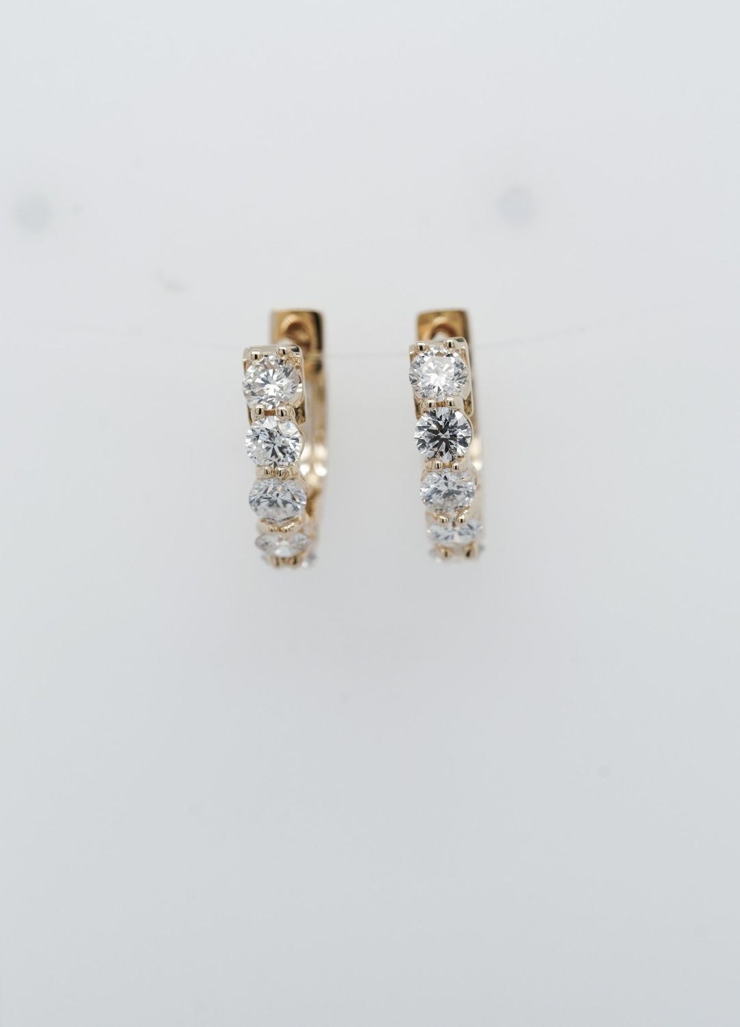 BTT- 14KY 2.15g .91ctw Diamond Huggie Hoop Earrings
