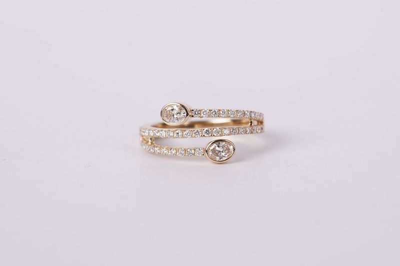 LVRX- 14KY 2.9g .75ctw Oval Diamond Bypass Fashion Ring (size 7)