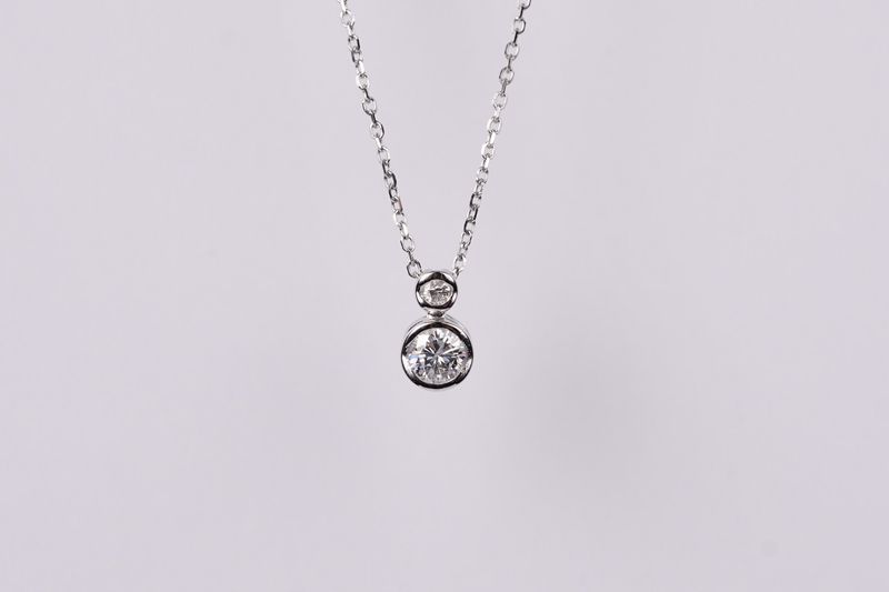 AER- 14KW 1.25g .22ctw Double Diamond Bezel Pendant 18&quot;
