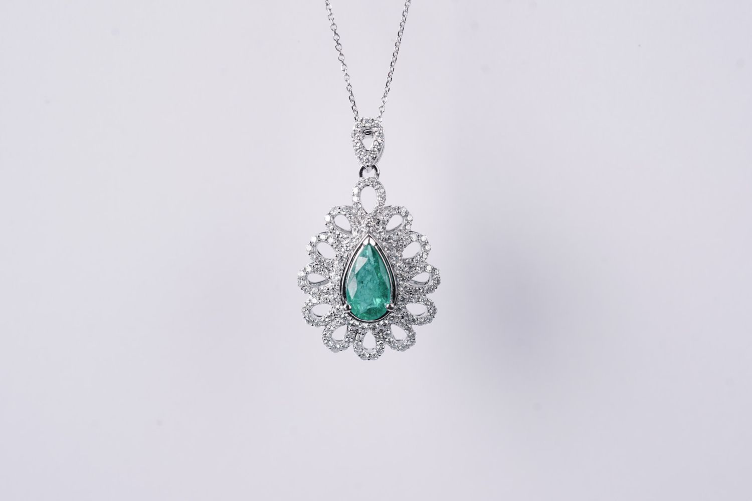 BLAX- 14KW 3.60g 1.49ctw (.79ctr) Emerald &amp; Diamond Halo Pendant 16-18&quot;
