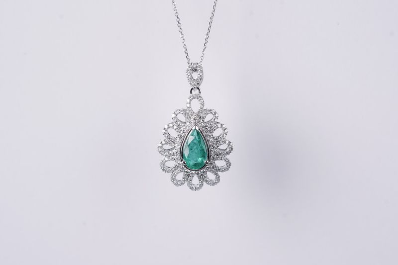 BLAX- 14KW 3.60g 1.49ctw (.79ctr) Emerald &amp; Diamond Halo Pendant 16-18&quot;