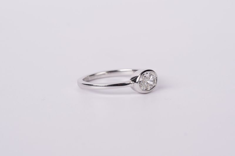 LTTX- 14KW 2.78g .59ct F/SI1 Oval Diamond Bezel Ring (size 7)