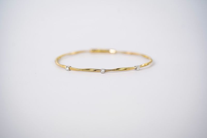 ERIX- 14KWY 4.73g .14ctw Diamond Flex Bangle