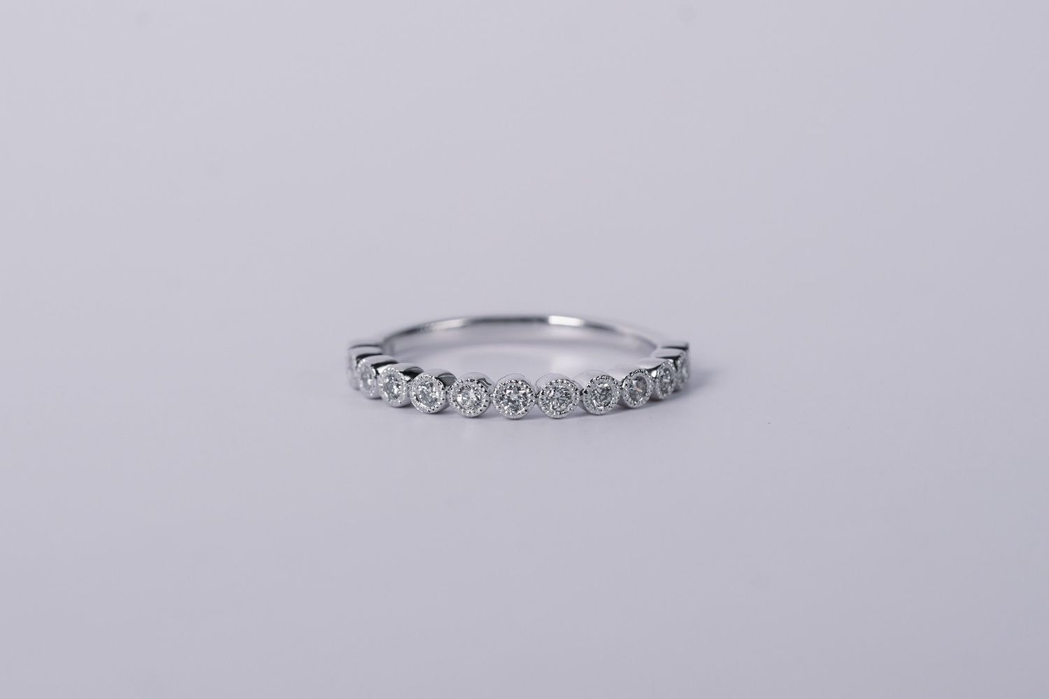 NTT- 14KW 2.3g .20ctw Diamond Milgrain Bezel Stackable Band (size 7)