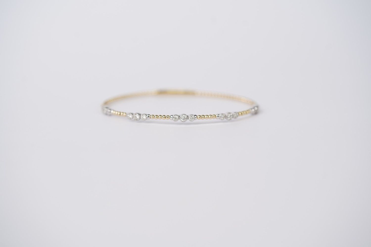 RTTX- 14KWY 5.60g .47ctw Diamond Flex Bangle
