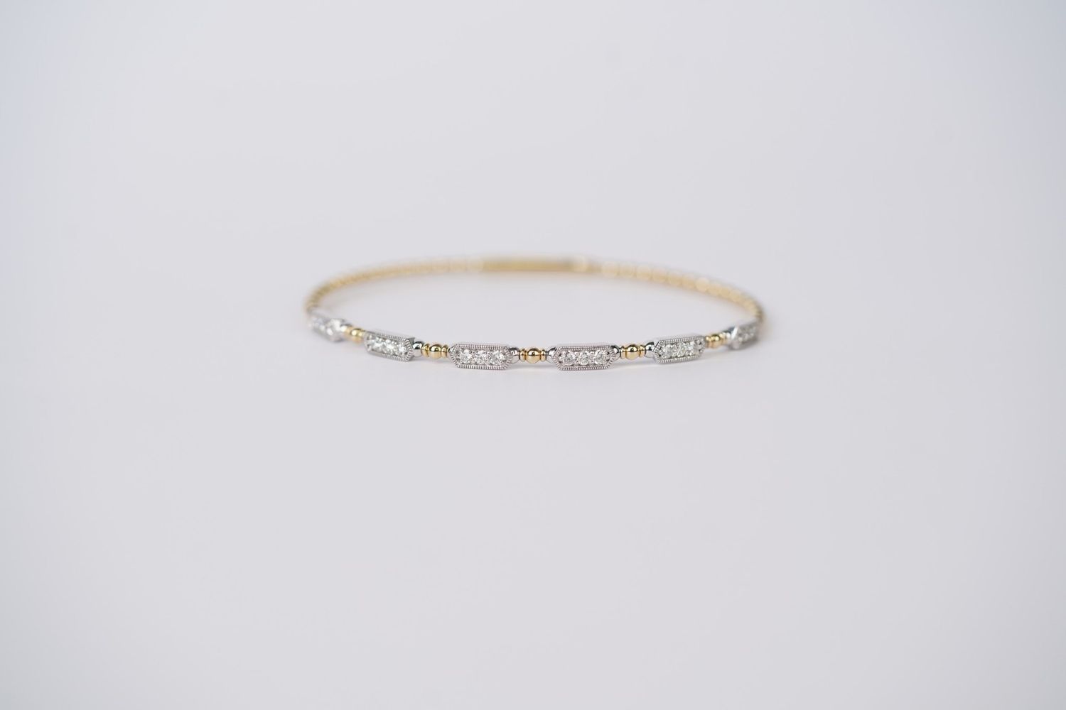 ITTX- 14KWY 7.29g .53ctw Diamond Fashion Flex Bangle