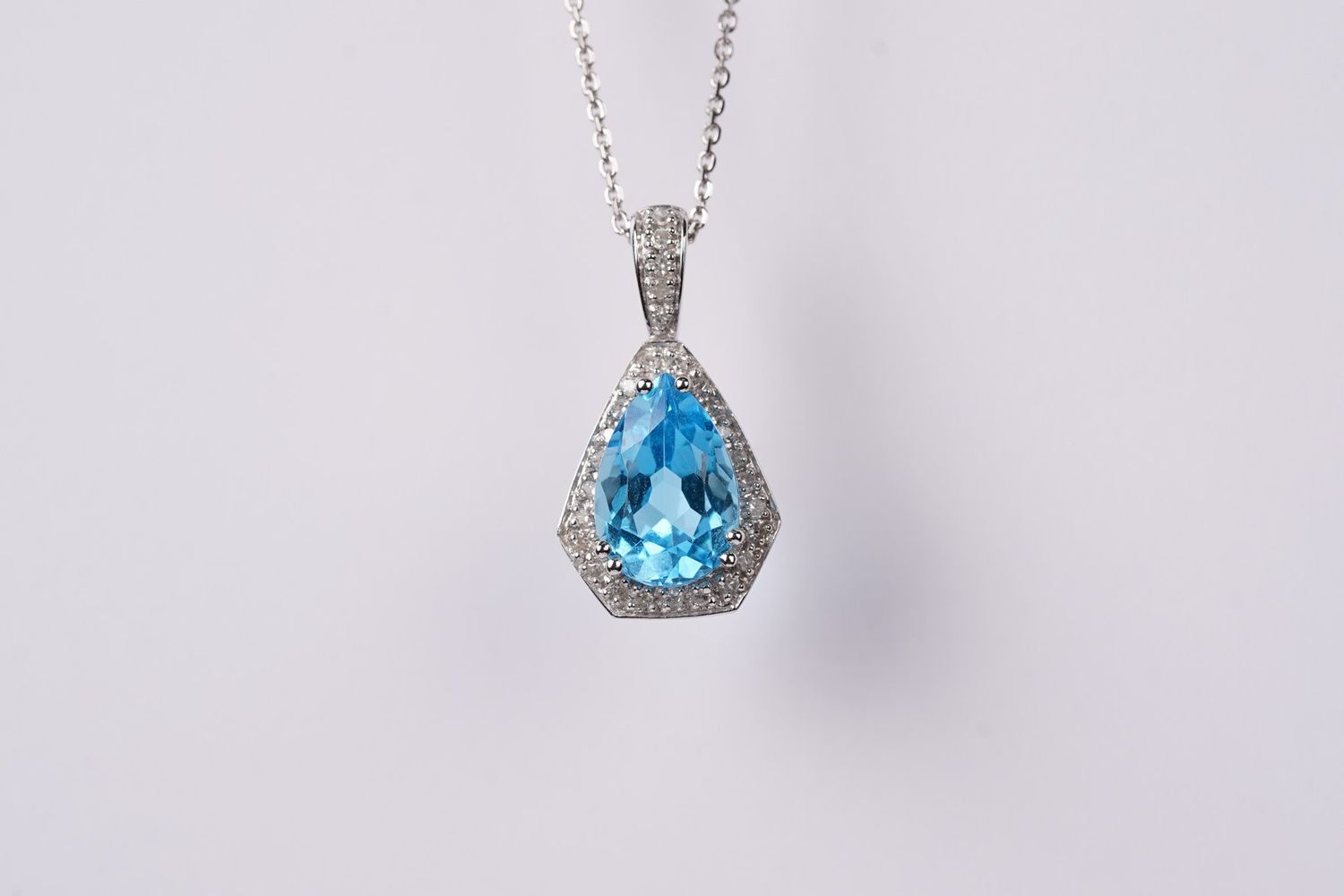 VRT- 14KW 4.06g 3.65ctw (3.50ctr) Blue Topaz &amp; Diamond Halo Pendant 16-18&quot;