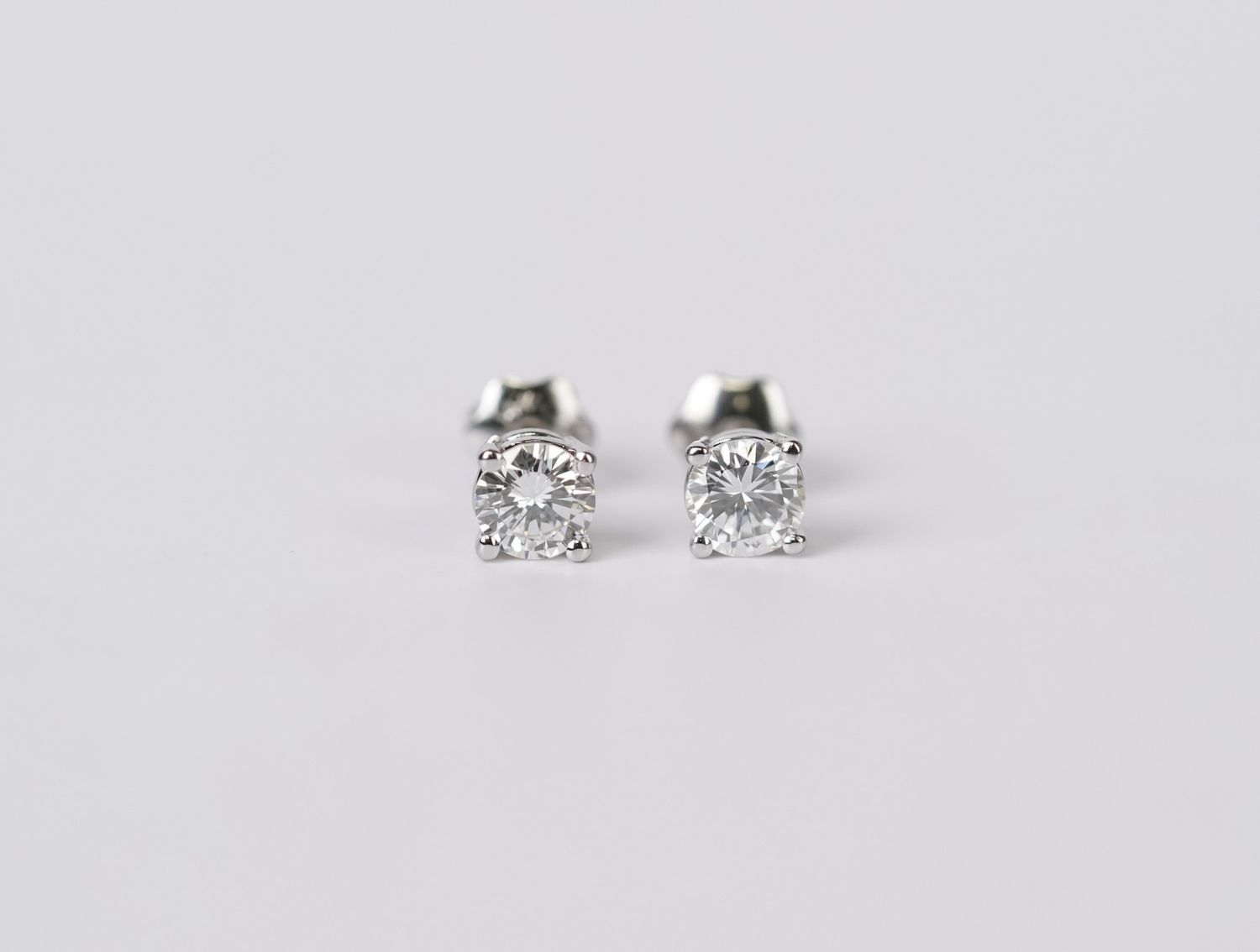 EETX- 14KW .65ctw I-J/VS2 Round Diamond Solitaire Earrings