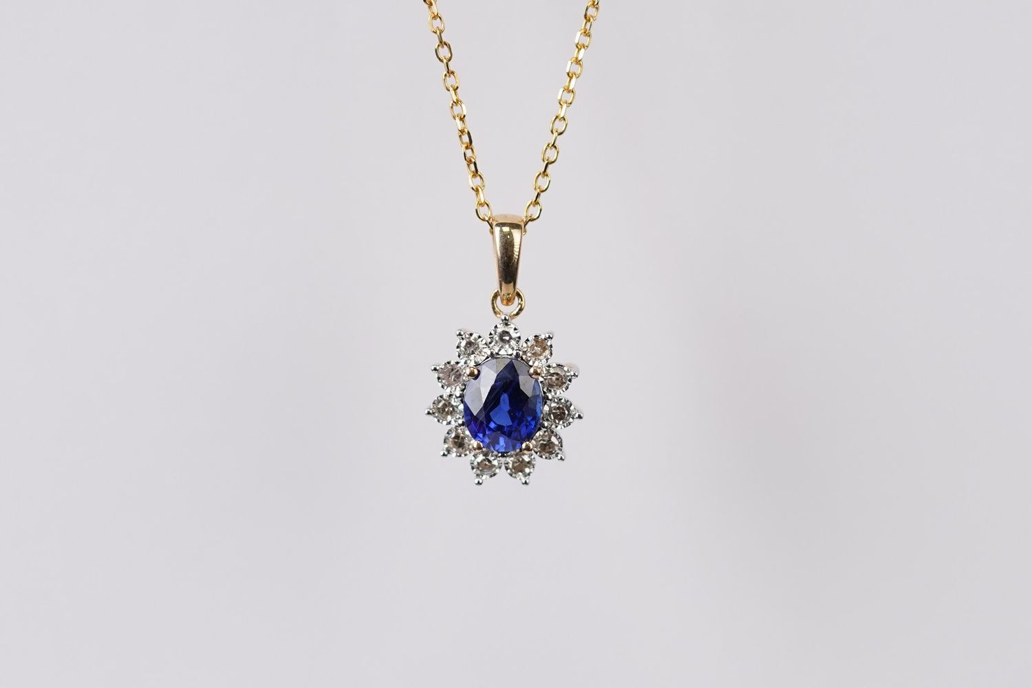 NDIX- 14KY 2.20g .90ctw (.74ctr) Sapphire &amp; Diamond Halo Pendant 16-18&quot;