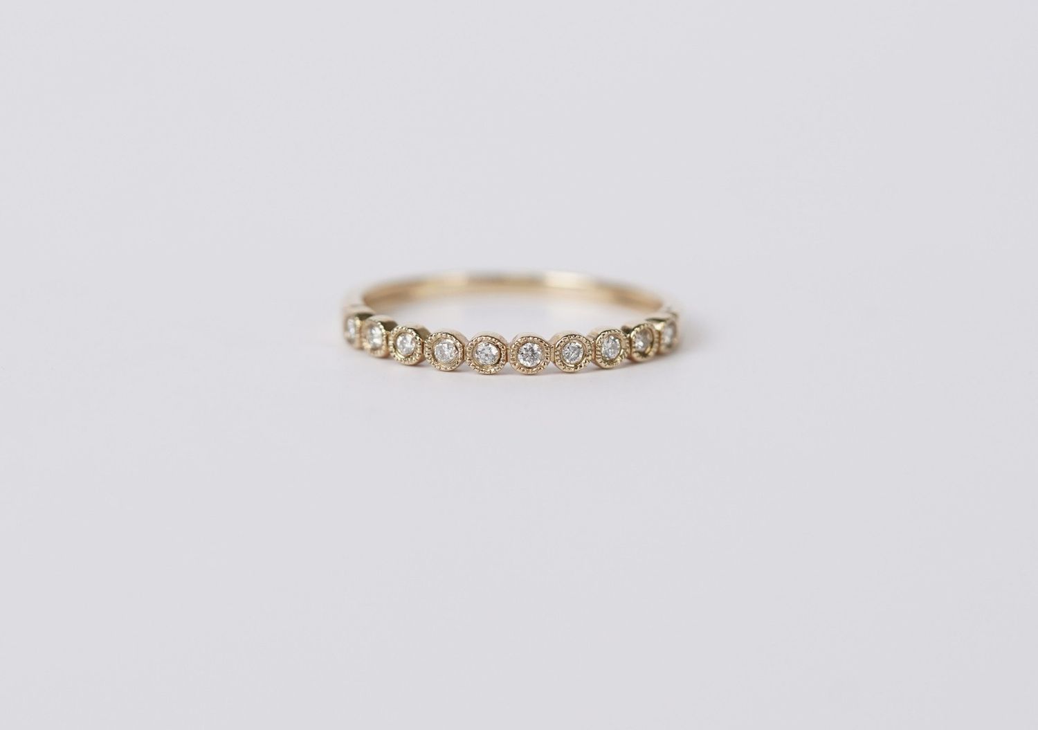 VET- 10KY 1.13g .11ctw Diamond Milgrain Bezel Stackable Band (size 7)