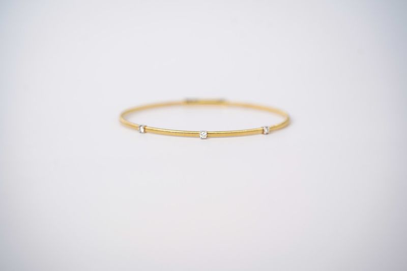 ETTX- 14KWY 4.44g .16ctw Diamond Flex Bangle