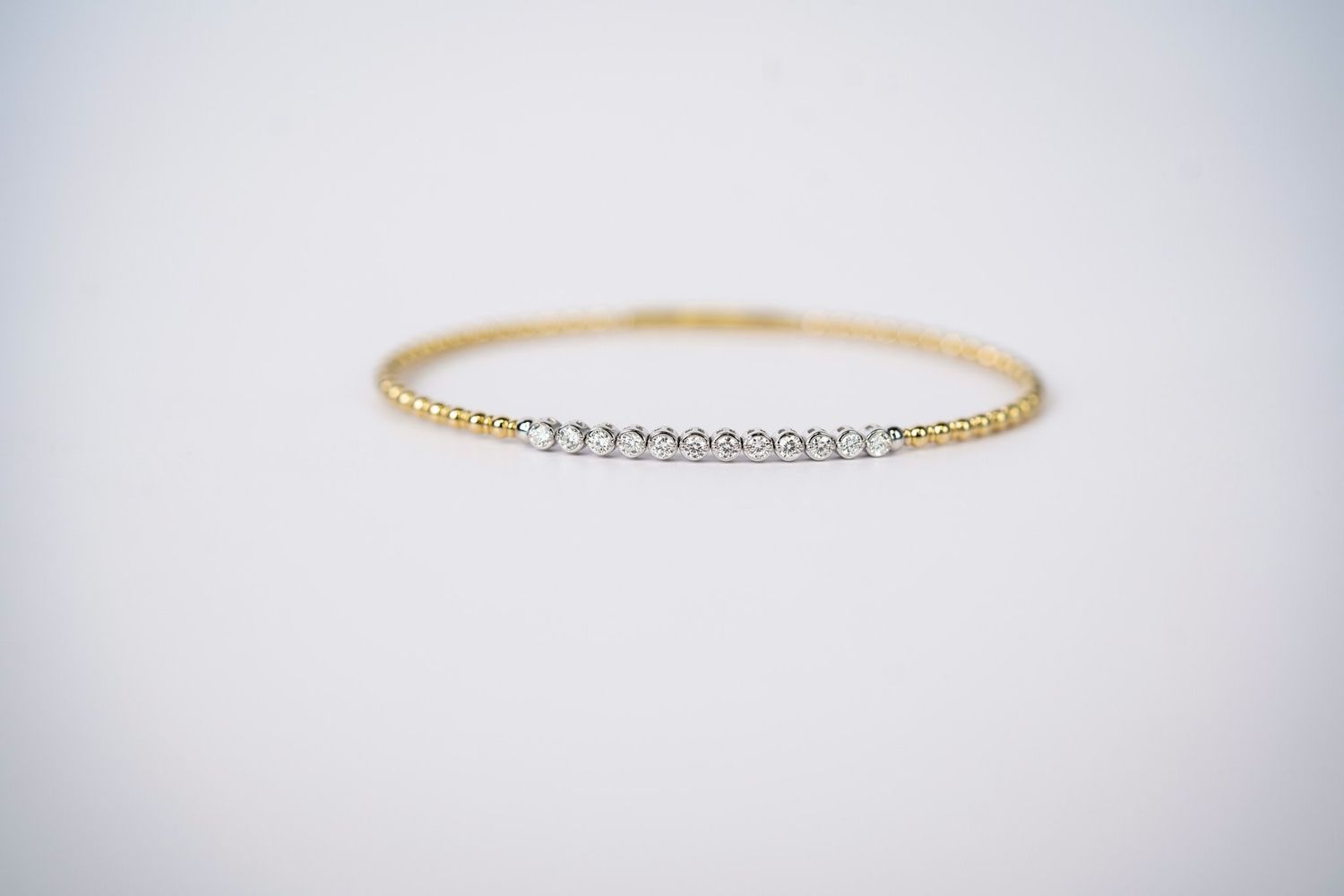 RNIX- 14KWY 5.31g .41ctw Diamond Flex Bangle