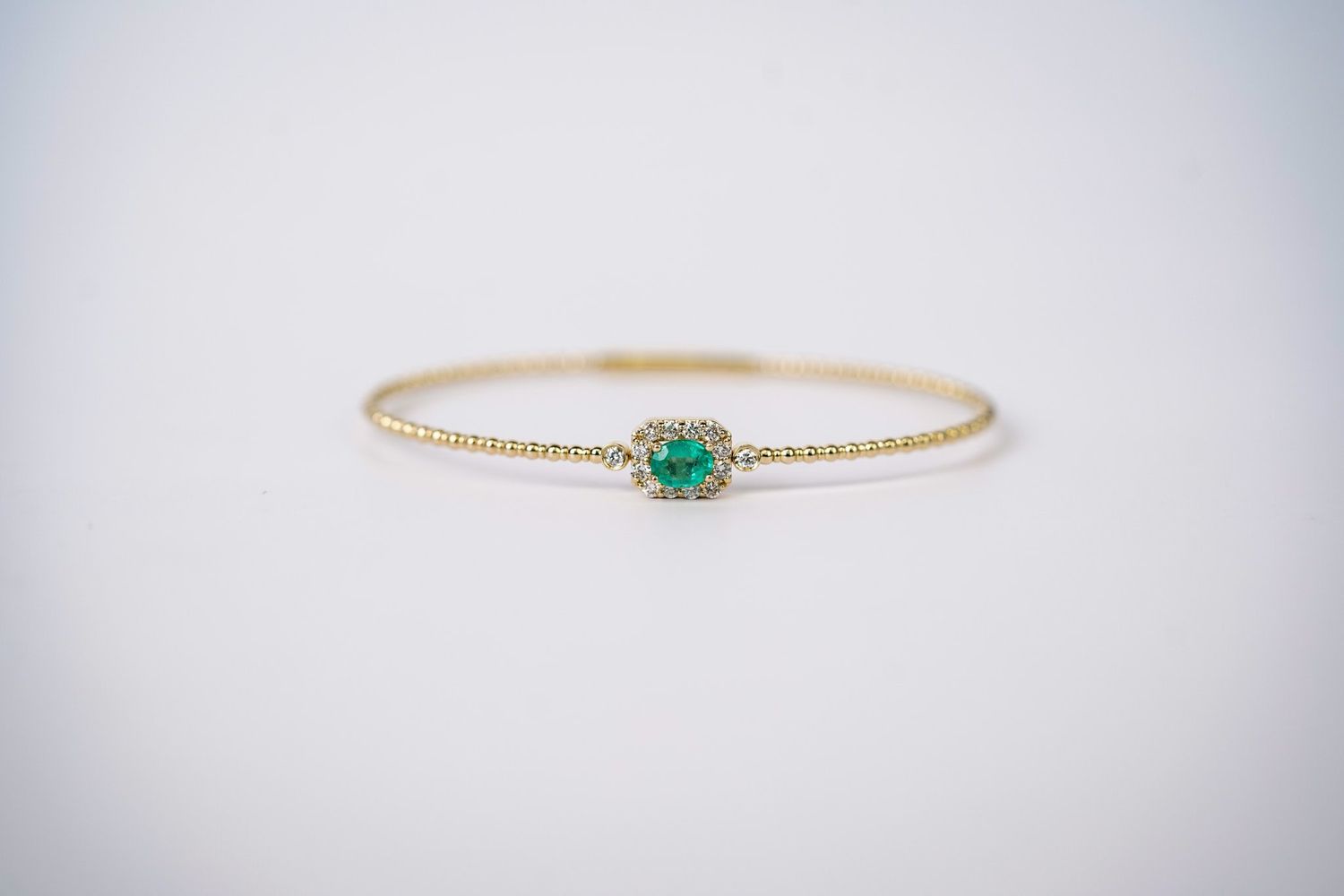 RRIX- 14KY 5.84g .87ctw (.50ctr) Emerald &amp; Diamond Flex Bangle